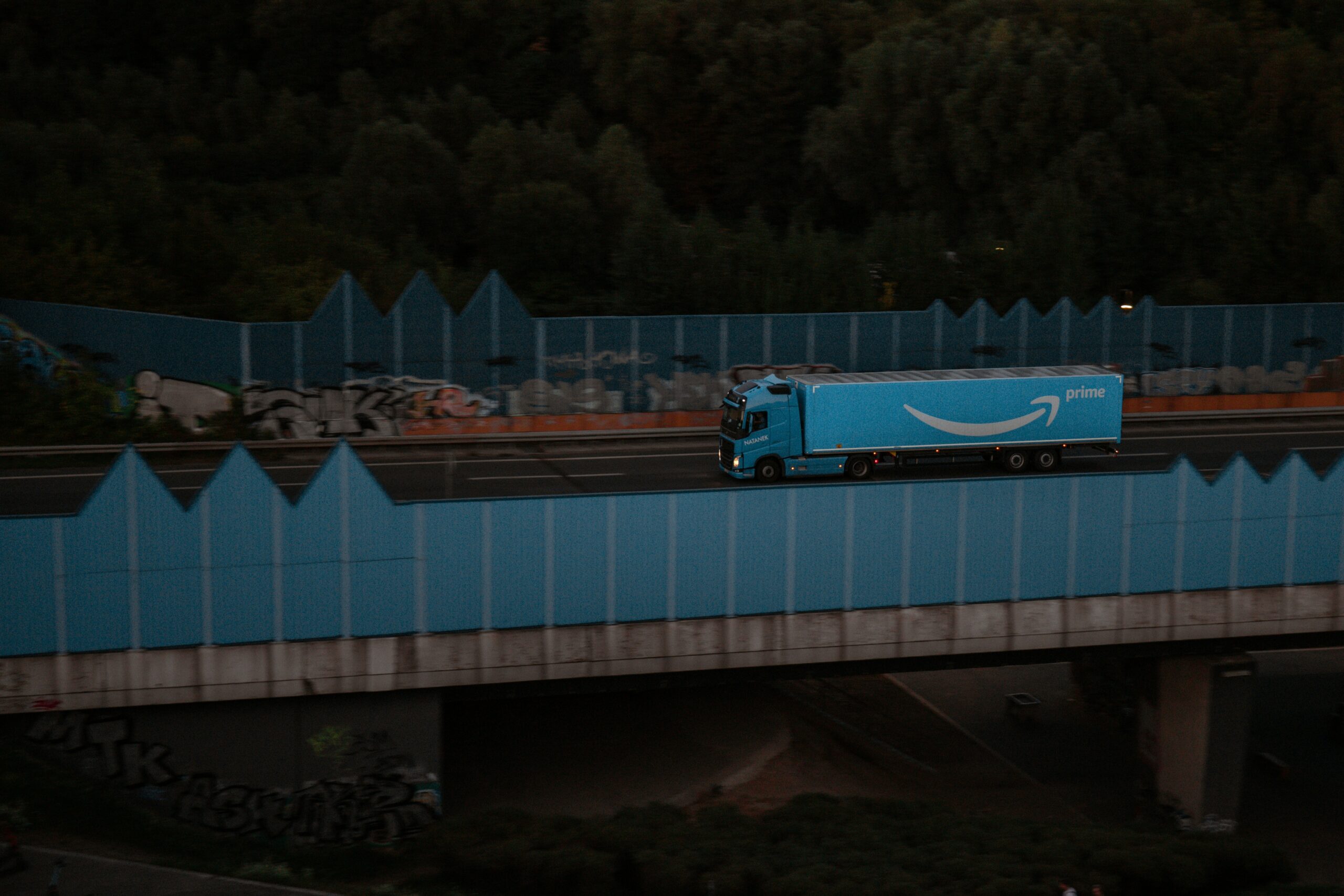 Amazon Prime delivery truck on an overpass